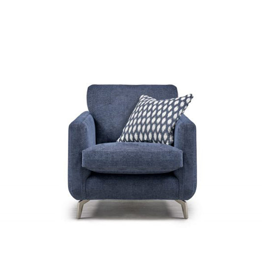 A blue Sasha armchair with a patterned cushion on it, showcasing a modern style with metal legs.