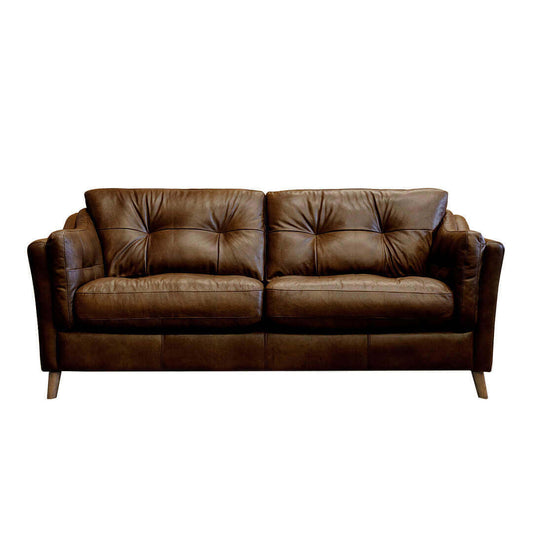 An image of a comfortable brown leather sofa. split in the middle of two back custhions. Stood on slim wooden feet.