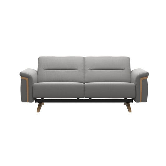 A contemporary Stressless Stella Wood 2-seater fabric sofa in light grey with oak stain leg and arm, featuring a soft and generous seat.