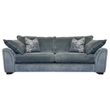A blue three-seater sofa with two accent pillows, shown with a wooden footrest.