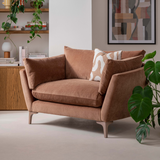 Brown sofa with decorative pillows in a living room setting