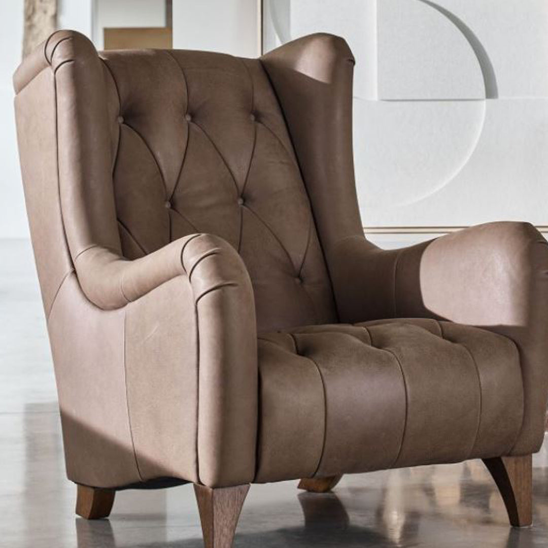 An lifestyle image of the Alexander & James Viola accent chair in a tan leather. 
