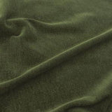 A close up image of the velvet green fabric for the Abraham Junior Large Sofa.