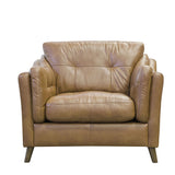 An cut out image of the Alexander and James Saddler Armchair. The armchair is in a brown leather.